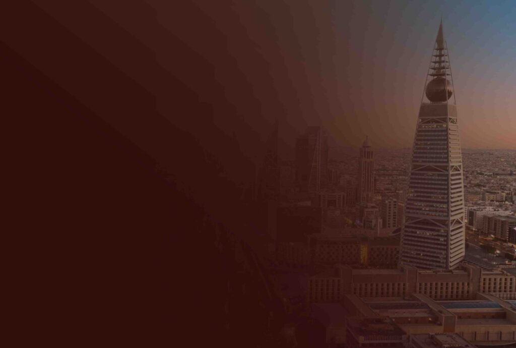The Riyadh skyline at dusk with the Kingdom Centre tower