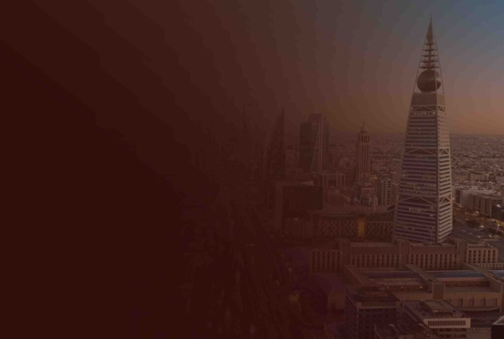 The Riyadh skyline at dusk with the Kingdom Centre tower